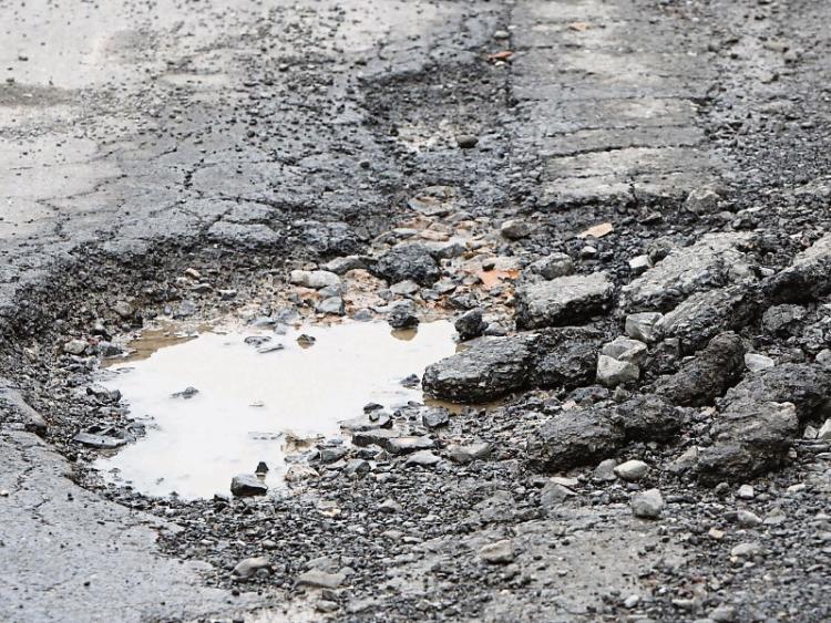 Water bursts may have caused subsidence to road