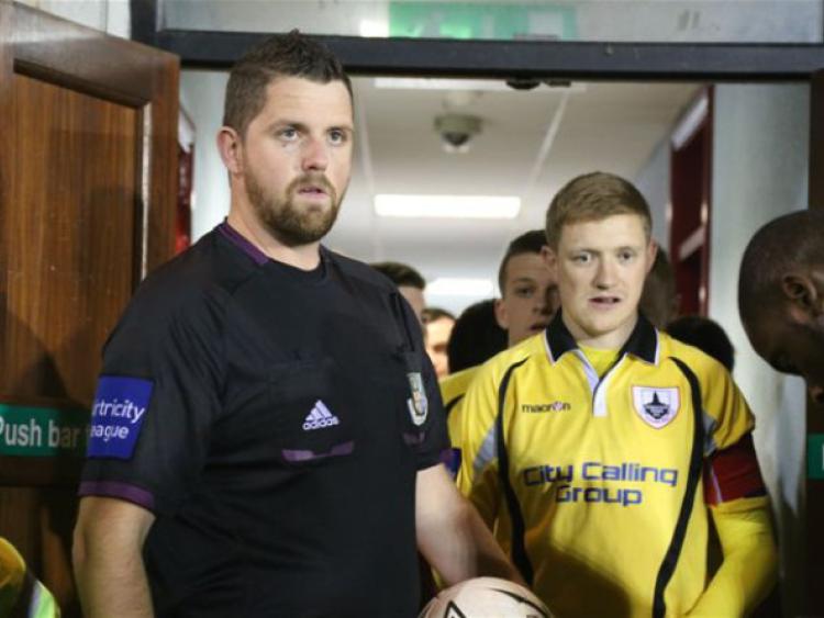 Referee Keith Callanan and Longford Town captain Corie Treacy prior to kick-off in last Friday's game. Photo: Tiernan Dolan