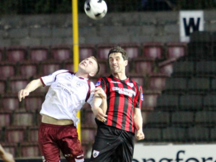 Longford Town defender Willie Tyrell is first to the ball in this aerial tussle. Action from the Airtricity League First Division game at City Calling Stadium on Saturday evening last.