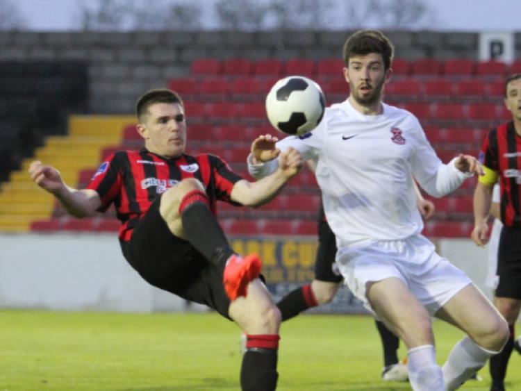 Longford goal hero David O'Sullivan attempts to control the ball despite the close attention of a Cobh Ramblers defender. Photo: Syl Healy
