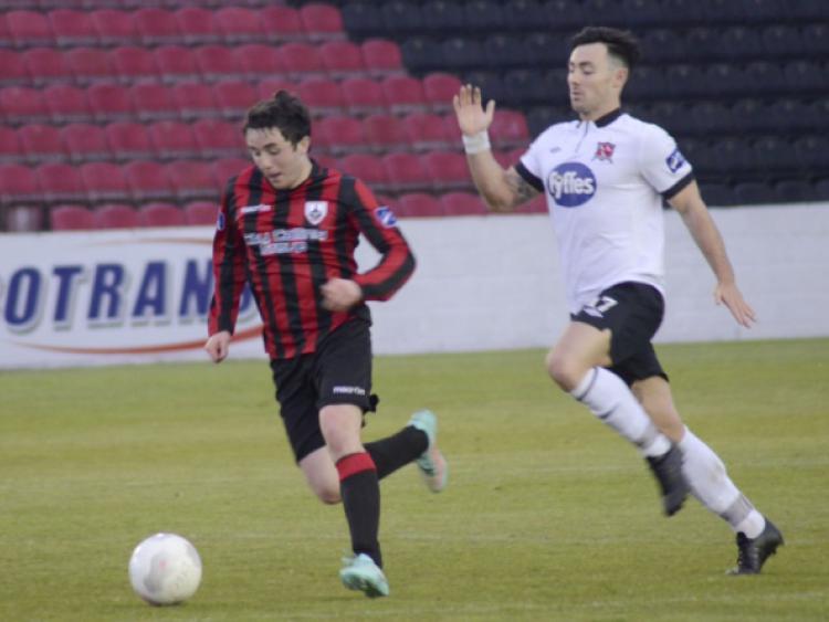 Jamie Mulhall surging forward for Longford Town in breaking away from Dundalk opponent Richie Towell. Action from the Premier Division league game at City Calling Stadium on Saturday night last.  Photo: Declan Gilmore