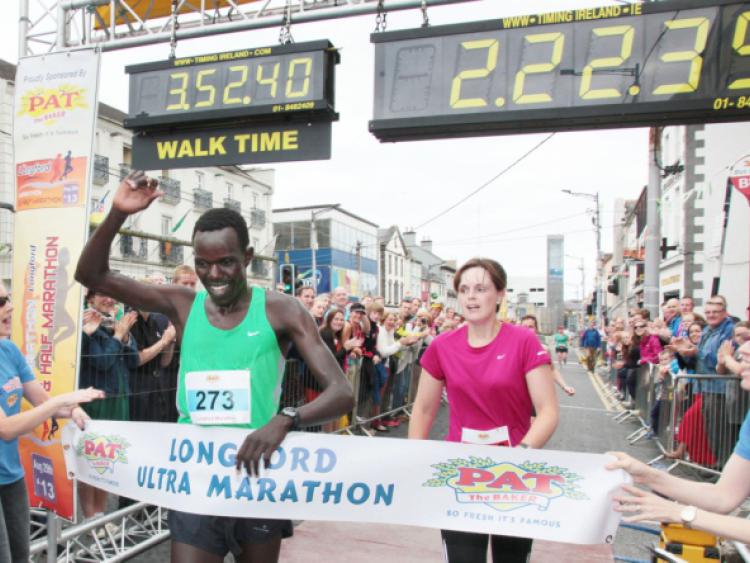 Kenya's Freddie Keron Sittuk raises his hand aloft after winning Sunday's Longford Men's Marathon. Photo by Shelley Corcoran
