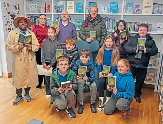 Pupils of St Mary's National School Edgeworthstown with Kim Taylor (Edgeworthstown Community Library Branch Librarian), Enda Ward (Home School Community Liason Officer) and Alan Conroy (Principal)