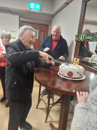 Joe Hunt cutting his 90th birthday cake at Ballymahon Bridge Club
