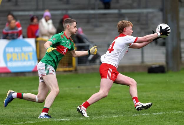 Cathal Gilligan on the attack for Abbeylara ahead of Colmcille defender Gerard Mulligan. Action from the SFC final on Sunday Photo: Syl Healy