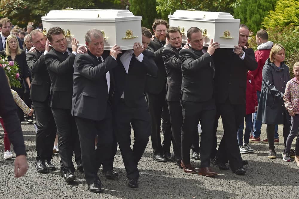 The coffins of mother and daughter Aisling Moore and Abbigael Moore-Tournié being carried from Our Lady Help of Christians Church, Swinford (Pic: Conor McKeown)