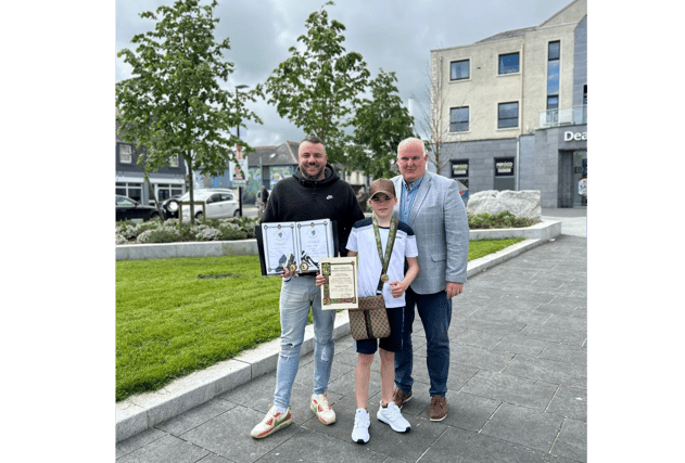 Joe Flaherty TD and newly elected Longford County Councillor Kevin Hussey pictured with local boxing champion Michael Nevin