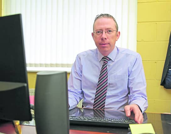 St Christopher's CEO Derek Scanlon at his desk Picture: Shelley Corcoran