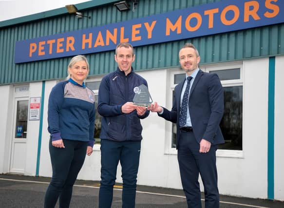 Geraldine Brady and David Hanley of Peter Hanley Motors pictured with Gary Murphy of PTSB as they received their 2023 CarsIreland Dealership Award for Best Presentation Picture: Shelley Corcoran