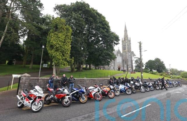 Students from Largy College and principal Sharon Magennis were among mourners who lined the steps of the church in Clones, while motorcycles revved in tribute to the racing fan ahead of the arrival of the hearse topped with floral tributes.