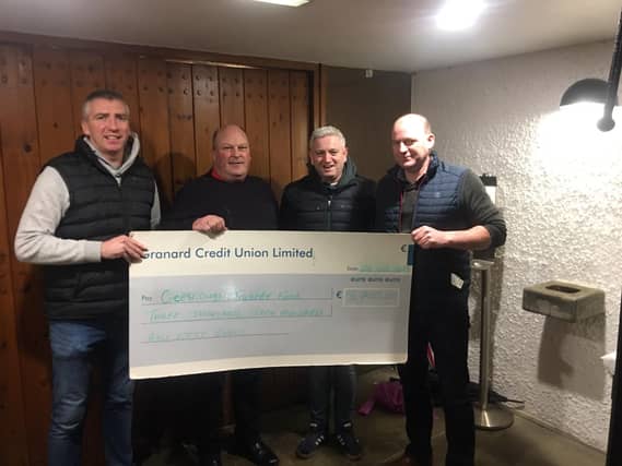 Paddy McGivney and Seamus Brady of Mullinalaghta Vintage Club presenting a cheque for €3750 to Brian McLoughlin and Lorcan Roarty on behalf of Creeslough Tragedy Fund