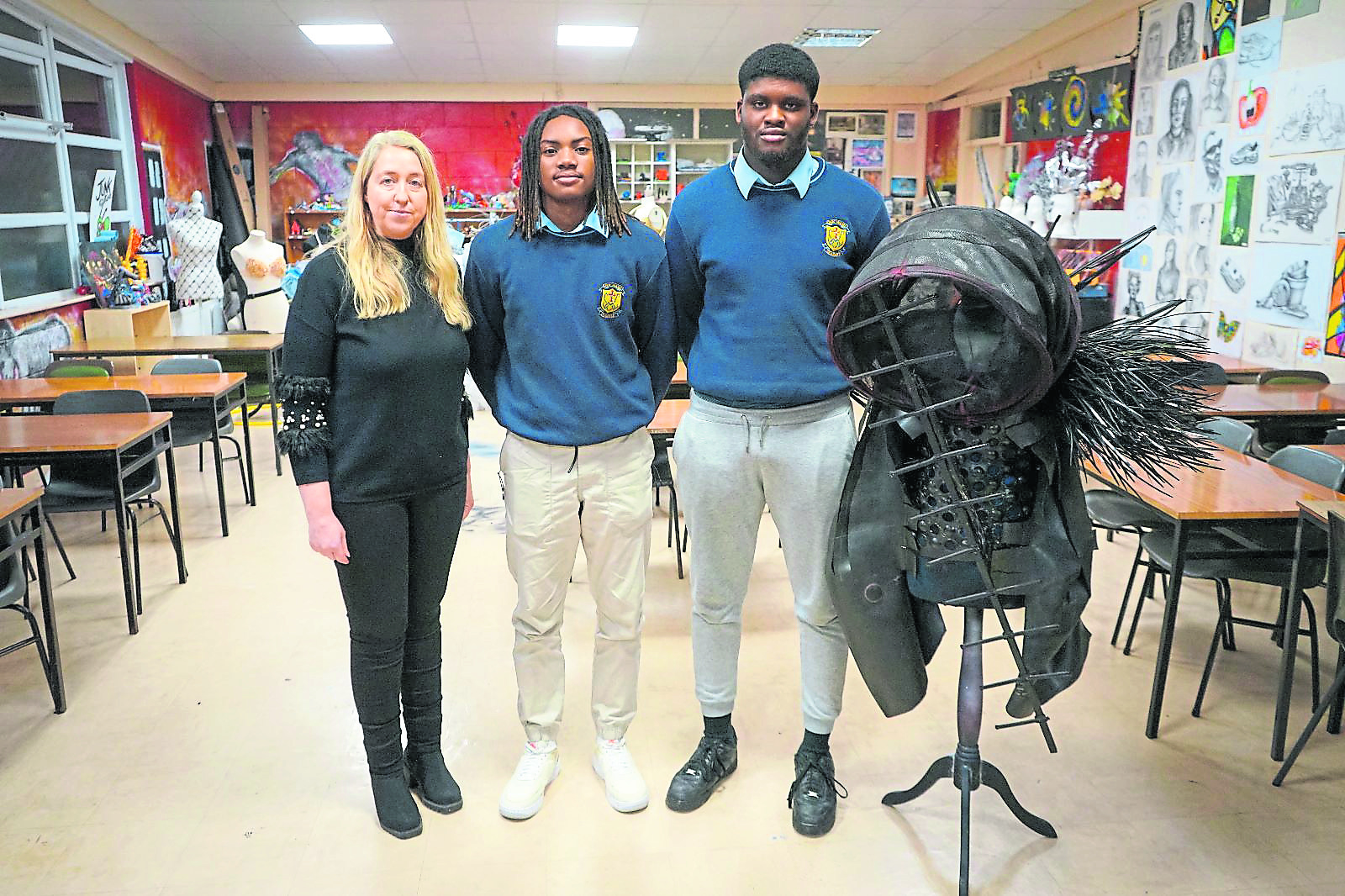 Charmaine Hetherton, Soloman Eduard and Josh Osabuehien with their costume Back to the Future