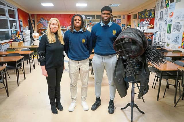 Charmaine Hetherton, Soloman Eduard and Josh Osabuehien with their costume Back to the Future