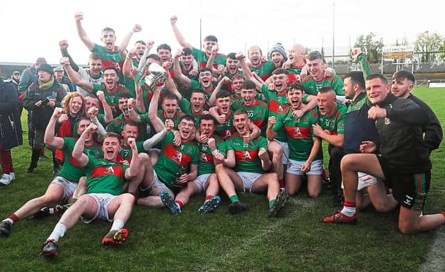 The thrilled Colmcille players celebrating with the Connolly Cup following the dramatic win over Mullinalaghta in the 2022 SFC Final Photo: Syl Healy