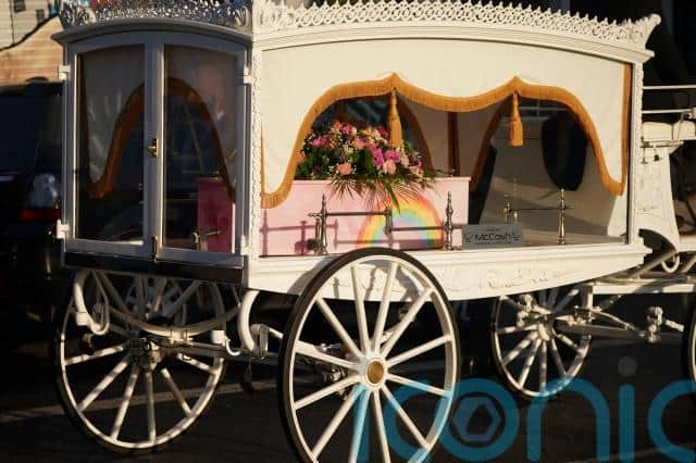 More than one hundred people stood outside the terraced house as Stella-Lily’s pink coffin painted with rainbows and stars was taken outside after a funeral gathering.