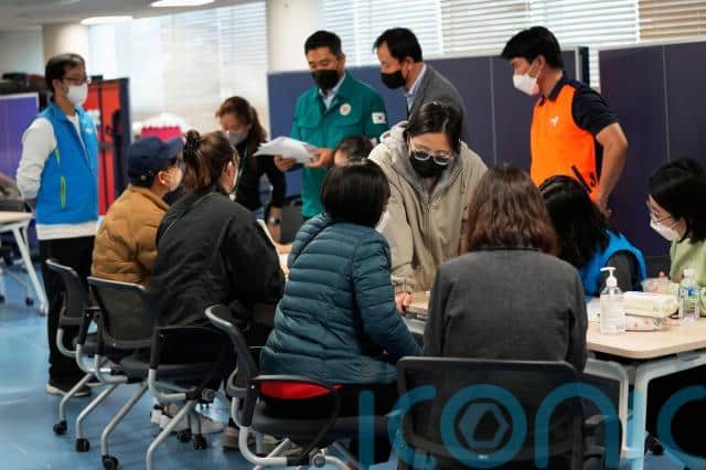 The city government said more than 2,600 people had called or visited a nearby city office as of Saturday afternoon, reporting missing relatives and asking officials to confirm whether they were among those injured or dead after the crush.