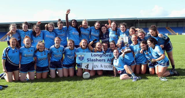 The jubilant Slashers squad, with captain Aisling Cosgrove lifting the Alison Smyth Cup, pictured following their slender win over Clonguish Photo: Syl Healy