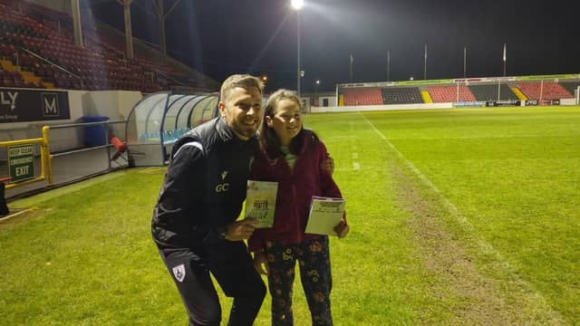 Joanne McDonnell, aged 9, winner of the Longford Town FC ‘Design the Match Programme Cover’ competition pictured with manager Gary Cronin following De Town’s 2-0 over Cobh Ramblers
