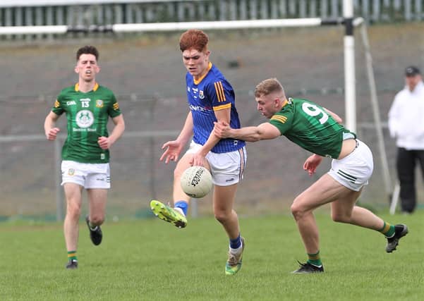 Longford's Darren Moffett lays off a foot pass PICTURE: Syl Healy