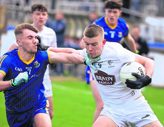 Cian O'Reilly on the ball for Kildare in this tussle with Longford opponent Jack Belton. Action from the Leinster Minor (U-17) Football Championship Round 2 clash
