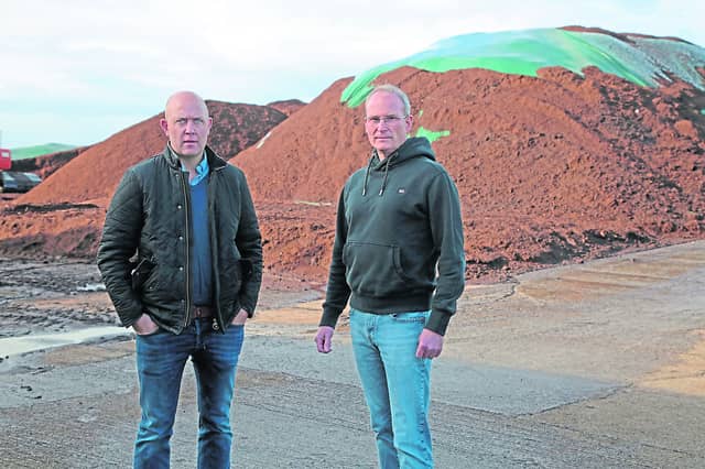 Cllr Paul Ross and Kevin Mahon of Klasmann-Deilmann stand beside the imported peat Picture: Shelley Corcoran