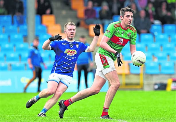 Fergal Sheridan on the ball for Colmcille ahead of Granard opponent Derek Sheridan. Action from the SFC quarter-final on Sunday Photo: Syl Healy