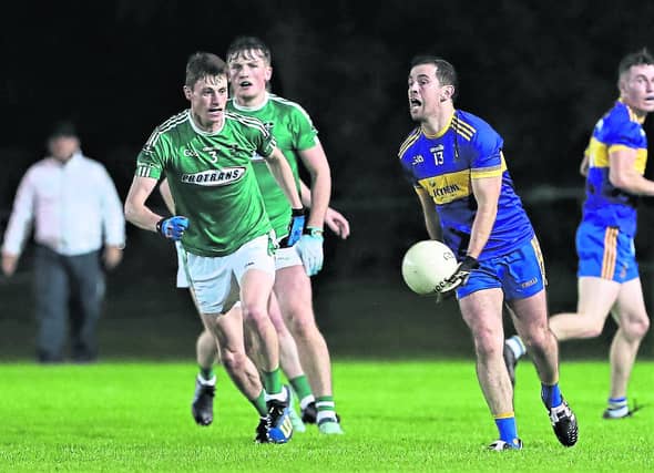 Francis McGee on the ball for Dromard ahead of Clonguish opponents Ronan Sweeney (3) & Packie Molloy. Action from the SFC Round 4 Pic: Syl Healy