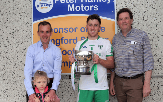 Killoe captain Daniel Mimnagh with the Connolly Cup along with sponsor David Hanley (Peter Hanley Motors) and Albert Cooney Pic: Syl Healy