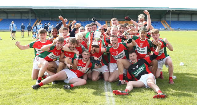 The victorious Clonbroney/Wolfe Tones U-18 players celebrate with the Harte Cup following their narrow win over Longford Slashers in the MFC final on Saturday Picture: Syl Healy