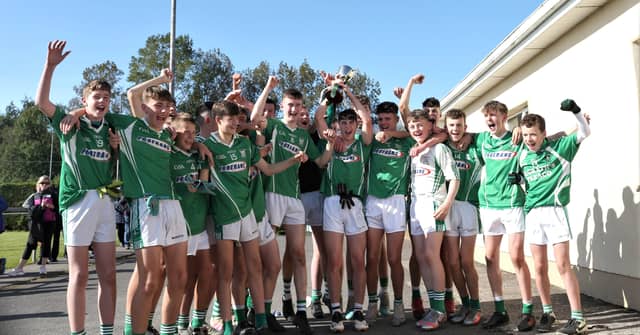 The victorious Clonguish Og U-16 football team with captain Conor Smith lifting the Juvenile Championship Cup following the final at Maguire Park on Saturday Picture Syl Healy
