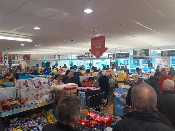 Huge crowds of shoppers line the checkout area in Longford's Aldi store this afternoon