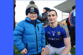 Darren Gallagher, who scored half of Longford's ten points, pictured with young supporter Malachy McGovern after Longford beat Offaly by 1-12 to 0-11 in the O'Byrne Cup Final Picture: Declan Gilmore