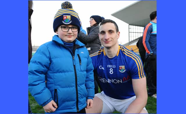 Darren Gallagher, who scored half of Longford's ten points, pictured with young supporter Malachy McGovern after Longford beat Offaly by 1-12 to 0-11 in the O'Byrne Cup Final Picture: Declan Gilmore