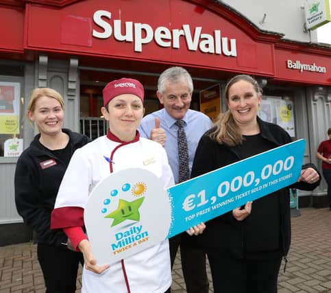 Owner of Smyth’s SuperValu Pat Smyth (centre) pictured with staff as the shop celebrated the win back in October PicTure: Mac Innes Photography