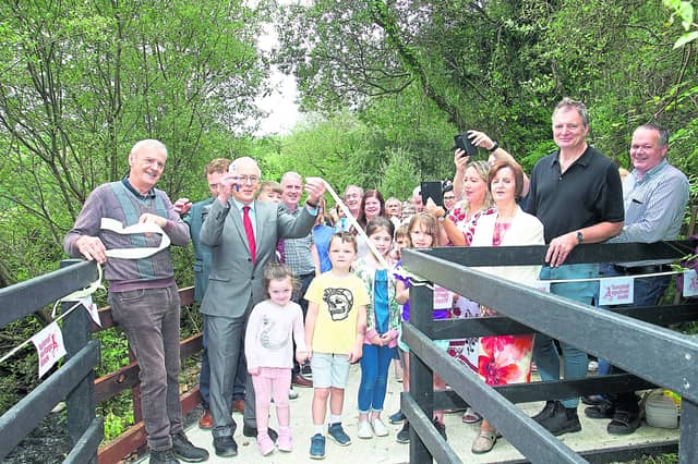 Local politcians join committee members and locals at the opening of a community waterfall in Colmcille.