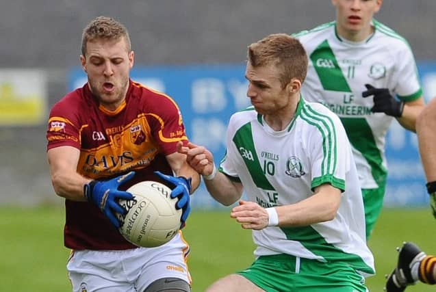 Dean Cosgrove on the ball for Fr Manning Gaels in this tussle with Killashee opponent Darren Cosgrove. Action from the IFC semi-final on Sunday. Photo: Declan Gilmore
