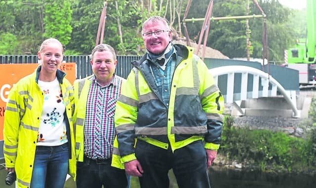 Members of Longford Regeneration Team Lorraine O'Connor, Gerry Shaughnessy and Brian Ross overseeing the installation of White's Bridge PICTURE: SYL HEALY
