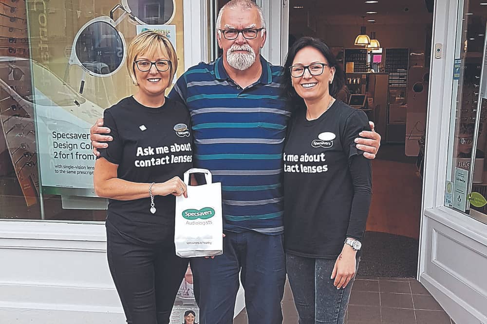 Specsavers Longford Store Manager Monica Tully and Dispensing Assistant Irmante Kasperaviciene with competition winner Noel Masterson