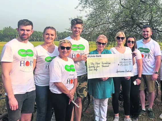 Specsavers delegation to Kolkata presenting cheque to Maureen Forrest. Specsavers Longford Director Keith McCallion far right.