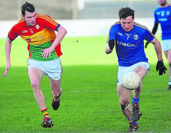Longford's Daniel Mimnagh surging forward ahead of Carlow opponent Sean Gannon. Picture: Declan Gilmore