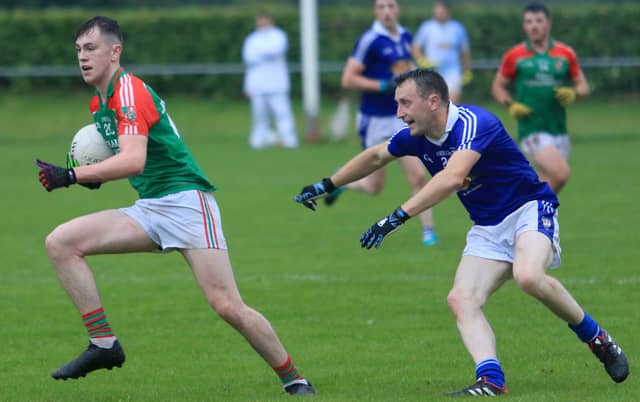 Paul Farley on the ball for Colmcille in breaking away from Granard opponent Brian Sheridan. Action from the SFC Group 2 clash at Lynch Park on Sunday evening. Photo: Syl Healy