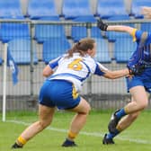 Longford's Niamh Feeney attempts to evade the clutches of Wicklow's Sarah Hogan during the TG4 Ladies Football Leinster Intermediate Championship semi-final. Photo by Declan Gilmore