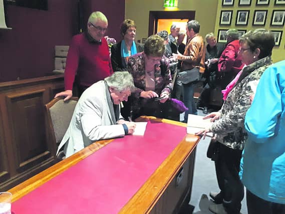Noel Monahan signs copies of Chalk Dust following the poetry collection's launch by Dr Niall McMonagle at Cavan Courthouse last week.
