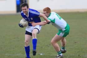 Paddy McGivney on the ball for Granard in this tussle with Killoe opponent Shane Clarke. Action from the Division 1 league game at the Higginstown grounds. Photo: Syl Healy