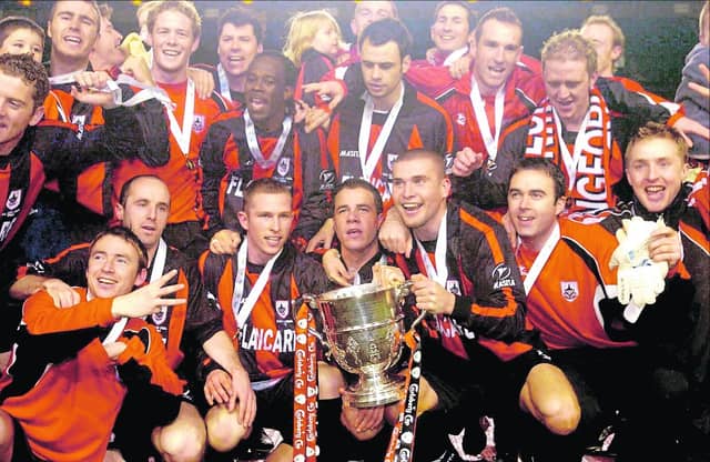 Ballinalee boy Sean Prunty celebrates with other members of the triumphant Longford Town squad after the FAI Cup was won for the second year in succession at Lansdowne Road back in October 2004.