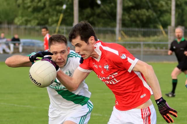 Thomas Mulvihill on the ball for Ballymahon but facing a determined challenge from St Brigid's Killashee opponent Emmet Skelly. Action from the Senior Football Championship Group 3 game. Pic:Syl Healy