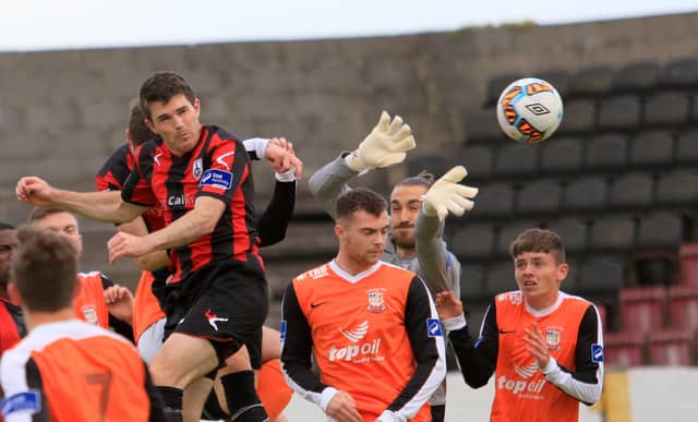 David O'Sullivan bang on target with a header to score the second goal for Longford Town against Athlone in the First Division league clash at City Calling Stadium last Saturday night. Pic: Syl Healy