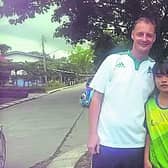 The late John Malone pictured with one of the many students who looked up to him.