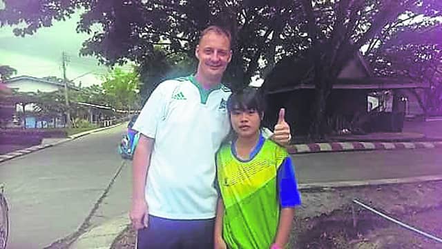 The late John Malone pictured with one of the many students who looked up to him.
