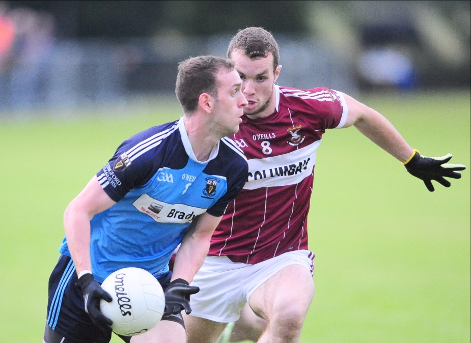 Andrew Dalton on the ball for Longford Slashers in this tussle with Mullinalaghta St Columba's opponent David McGivney in the Senior Football Championship first round game. Photo: Declan Gilmore